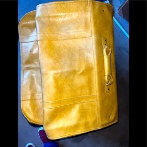 Suit/Dress/Coat- Leather luggage travel carrier.